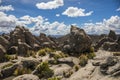 Beautiful view of huge rock formations with a cloudy blue sky in the background Royalty Free Stock Photo