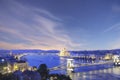 Beautiful view of the Hungarian Parliament and the Szechenyi chain bridge across the Danube in the panorama of Budapest at night Royalty Free Stock Photo