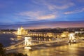 Beautiful view of the Hungarian Parliament and the Szechenyi chain bridge across the Danube in the panorama of Budapest at night Royalty Free Stock Photo