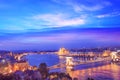 Beautiful view of the Hungarian Parliament and the Szechenyi chain bridge across the Danube in the panorama of Budapest at night Royalty Free Stock Photo