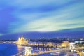 Beautiful view of the Hungarian Parliament and the Szechenyi chain bridge across the Danube in the panorama of Budapest at night Royalty Free Stock Photo