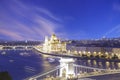 Beautiful view of the Hungarian Parliament and the Szechenyi chain bridge across the Danube in the panorama of Budapest at night Royalty Free Stock Photo