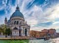 Beautiful view of iconic basilica di Santa Maria della Salute or St Mary of Health by waterfront of Grand Canal, Venice