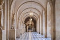 The beautiful view inside of the Empty Marble Hallway at Versaille Palace in France