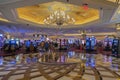 Beautiful view of interior of casino in Venetian hotel with people playing slot machines. Las Vegas. Royalty Free Stock Photo