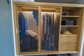 Beautiful view of interior of the clothes in wardrobe and compartment for safe in hotel room. Royalty Free Stock Photo