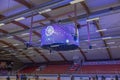 Beautiful view of interior of ice arena at sports complex with both children and adults skating on ice.