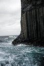 Beautiful view of the Isle of Staffa in Scotland, with a rocky shoreline