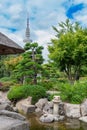 Beautiful view of Japanese Garden in Planten um Blomen park with famous Heinrich-Hertz-Turm radio telecommunication Royalty Free Stock Photo