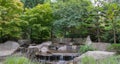 Beautiful view of Japanese Garden in Planten um Blomen park with famous Heinrich-Hertz-Turm radio telecommunication