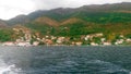 Beautiful view of the Kotor Bay between Croatia and Montenegro. Panormama on the mountains and dimiki with tiled roofs.