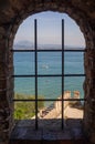 Beautiful view on Lake Garda and Italian Alps through window