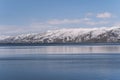 Beautiful view of the lake and mountains with snow. Armenia ,Sevan lake