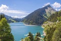 Beautiful view of a lake surrounded by mountains in Longrin lake and dam Switzerland, Swissalps