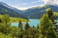 Beautiful view of a lake surrounded by mountains in Longrin lake and dam Switzerland, Swissalps