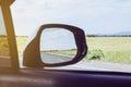 Beautiful view landscape on car mirror from inside a car on road,Travel and vacation concept Royalty Free Stock Photo