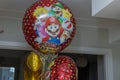 Beautiful view of large helium balloons with cartoon characters at child\'s birthday party in apartment.