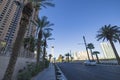 Beautiful view of Las Vegas Strip road leading to the Strat casino-hotel against the backdrop of cloudless blue sky