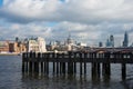 Beautiful view of London skyline from Riverbank. Old wooden pier, Saint Paul Cathedral and skyscrapers. Cloudy day, sunset Royalty Free Stock Photo