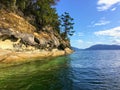 A beautiful view of a long shoreline of sea caves caused by coastal erosion on wallace island, in the gulf islands Royalty Free Stock Photo