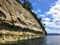 A beautiful view of a long shoreline of sea caves caused by coastal erosion on wallace island, in the gulf islands Royalty Free Stock Photo