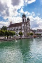 Beautiful view of the Lucerne Jesuit Church Jesuitenkirche on Reuss river side in old town of Lucerne with reflection in water,