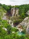 Beautiful view of the lush forest with majestic cliffs and waterfalls. Plitvice Lakes National Park Royalty Free Stock Photo