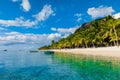 Beautiful view of the luxury beach in Mauritius. Transparent ocean, white sand beach, palms and sky Royalty Free Stock Photo