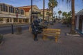 Beautiful view of main street in Oranjestad with cute statue of black hippopotamus on advertising bench