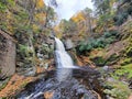 Beautiful view of the main waterfall surrounded by stunning fall foliage near Bushkill Falls, Pennsylvania, U.S