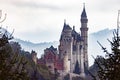 Beautiful view of the majestic Neuschwanstein Castle on a cloudy day, Bavaria, Germany