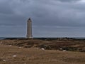Malarrif lighthouse on the western coast of SnÃÂ¦fellsnes peninsula, west Iceland on cloudy winter day with brown grass.