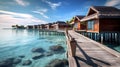 Beautiful view at Maldivas water villas with wooden walkway above the ocean water, connecting bungalows to island