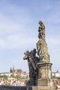 Beautiful view of the Malostranska tower of Charles Bridge at dawn in Prague