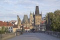 Beautiful view of the Malostranska tower of Charles Bridge at dawn in Prague