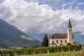 Beautiful view of Maria Lourdes church in Laas, South Tyrol, Italy under a dramatic sky