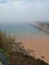 beautiful view of the MataleÃ±as beach of the city of Santander in a spring misty day Royalty Free Stock Photo