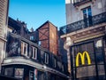 Beautiful view of McDonald sign with buildings around in Nantes in France