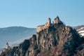 Beautiful view of the medieval castle on the rock in the mountains Royalty Free Stock Photo
