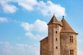 Beautiful view of medieval castle square towers over blue sky