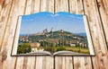 Beautiful view of the medieval town of San Gimignano Italy - Tuscany - 3D render of an opened photo book isolated on white
