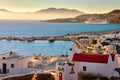 Beautiful view of Greek town by seafront of mediterranean island at sunset. Mykonos, Greece. Port, bay, boats, cruise Royalty Free Stock Photo