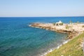 Beautiful view of the Mediterranean Sea and rocky shore under the blue sky