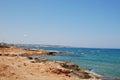 Beautiful view of the Mediterranean Sea and rocky shore under the blue sky