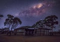 Beautiful view of the Milky Way over a destroyed wooden building Royalty Free Stock Photo