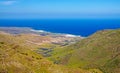 Beautiful view from montain top on valley, serpentine road, blue sea, white village - Majanicho, North Fuerteventura Royalty Free Stock Photo