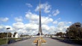 Beautiful view of monument with rocket on background of blue sky. Action. Front view of rocket monument in park in fine