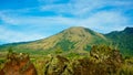Beautiful view of Mount Guntur with white clouds against a bright blue sky Royalty Free Stock Photo
