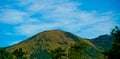 Beautiful view of Mount Guntur with white clouds against a bright blue sky Royalty Free Stock Photo