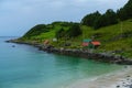 Beautiful view of mountain houses at the coastline in Refviksanden Beach